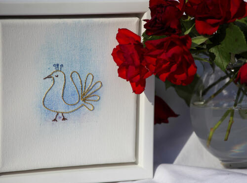 Stickerei "Vogel" in gold und blau